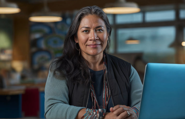 Native American woman at computer